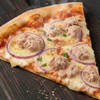 Large tuna pizza slice with big chunks