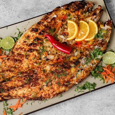 Grilled mullet meal with seafood soup