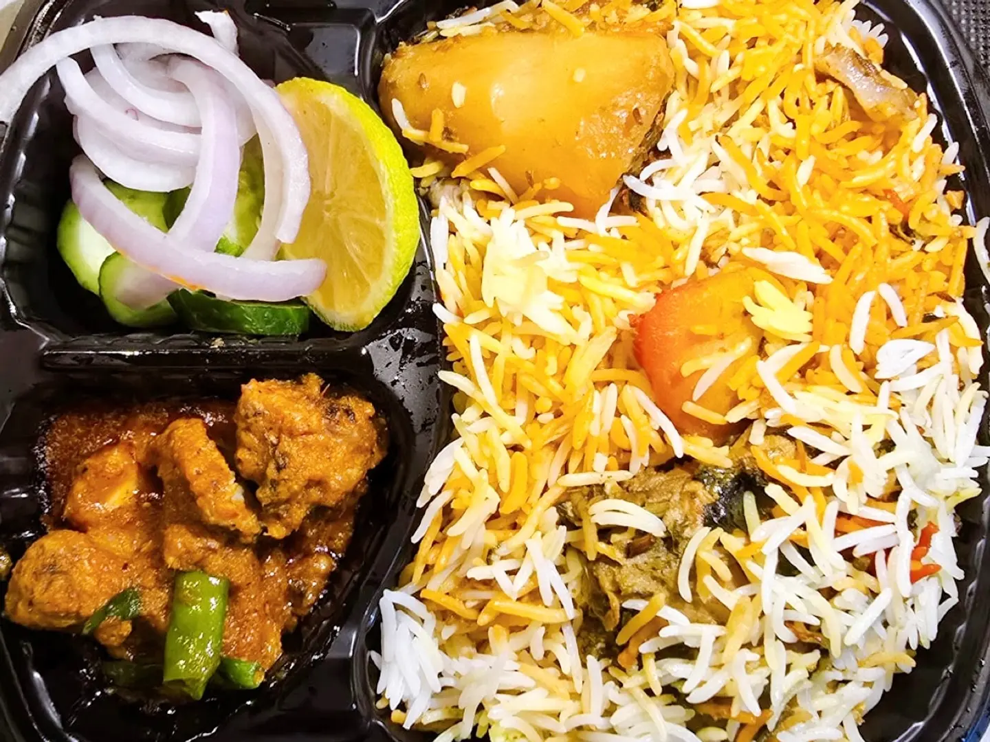 Chicken Biryani, Chicken Karhae, One Roti, Salad And Raita.