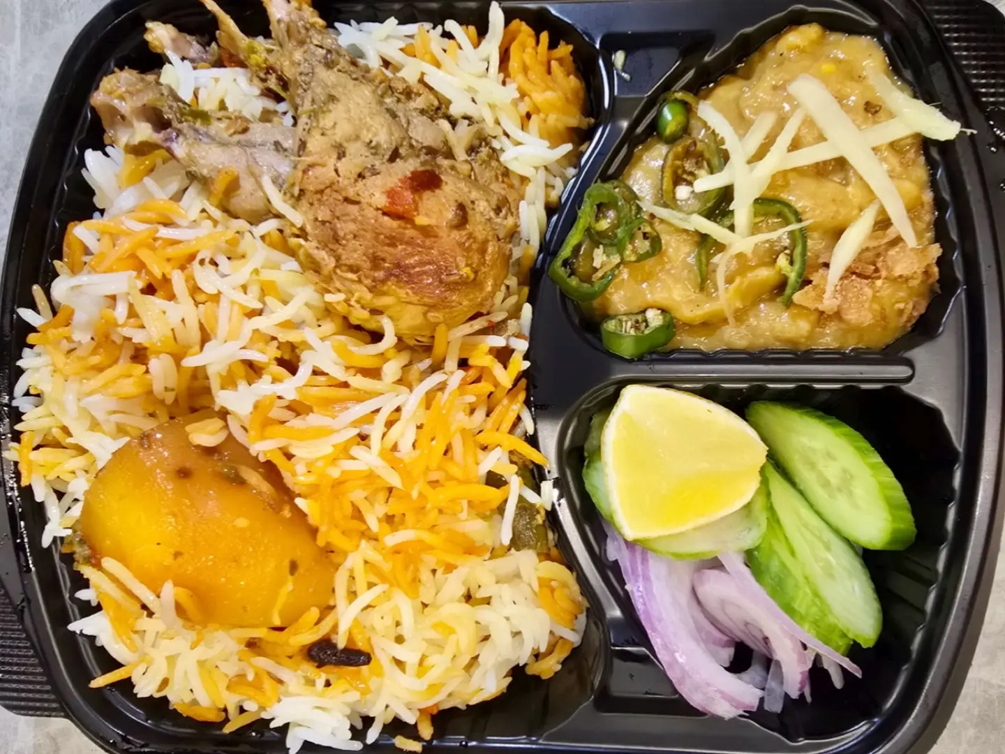 Chicken Biryani, Beef Haleem, One Roti,Salad And Raita.