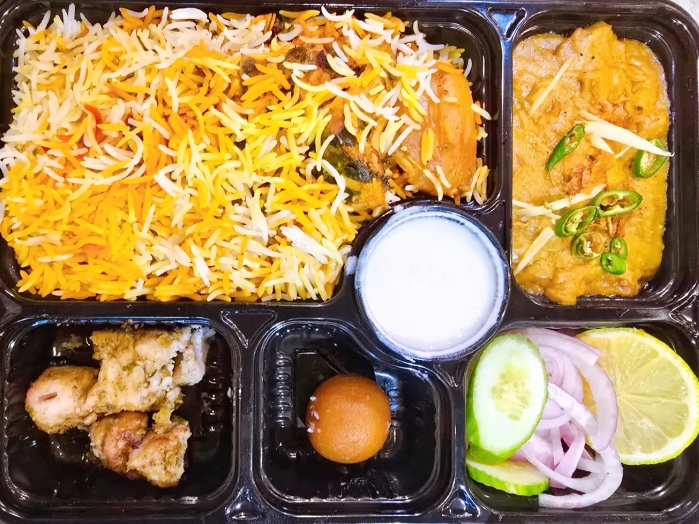 Chicken Biryani, Beef Haleem, Bbq Chicken Tikka Boti, Raita, Salad, Gulab Jaman And One Roti