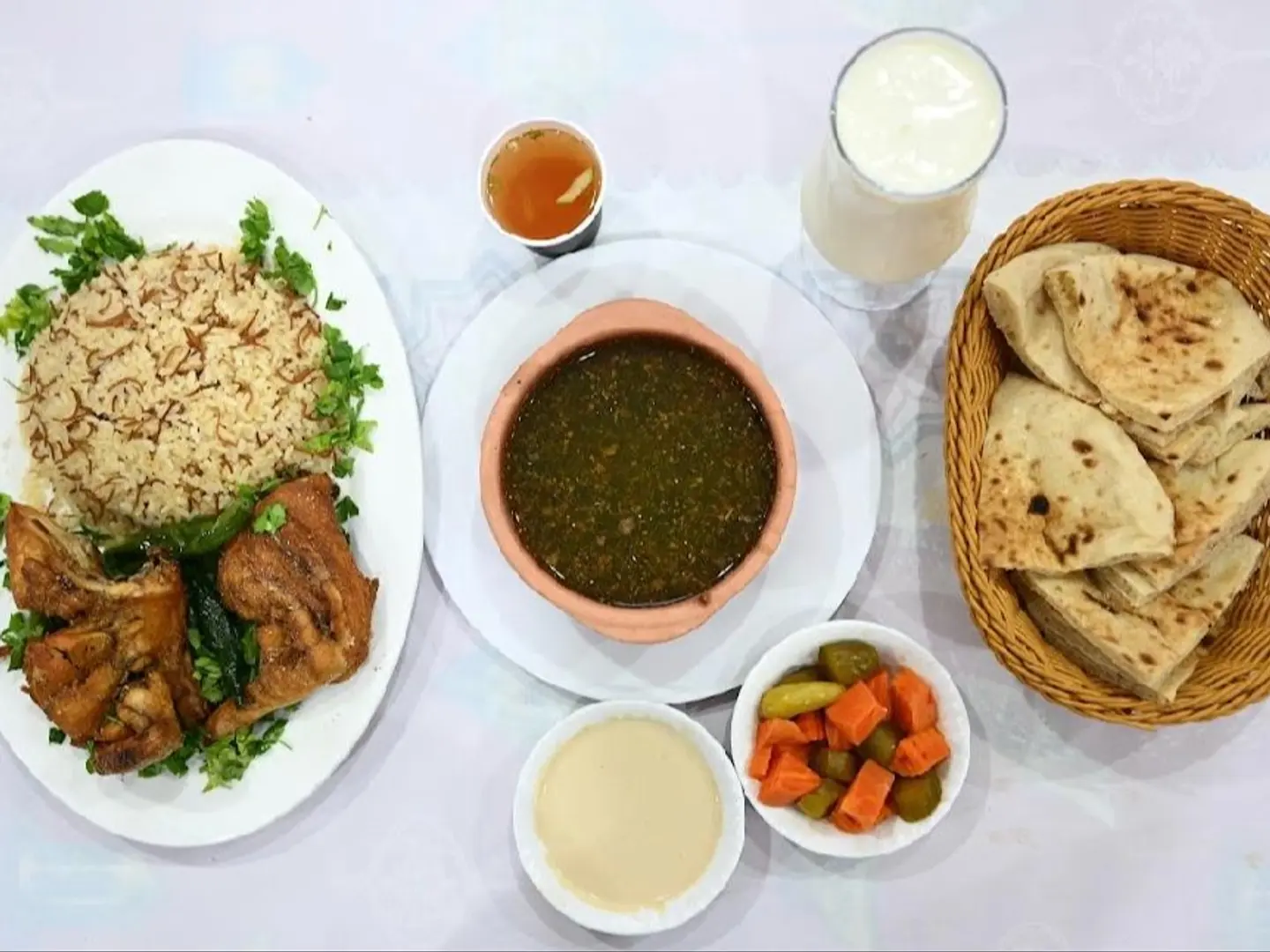 Half A Roasted Chicken Meal With Vermicelli Rice, Molokhia, And Alphabet Soup