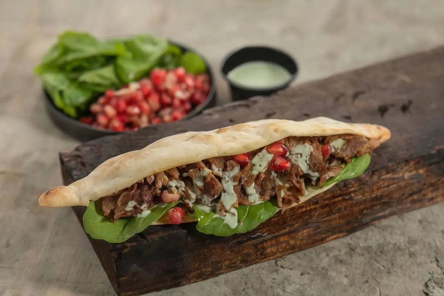 Meat With Arugula, Pomegranate And Tahini