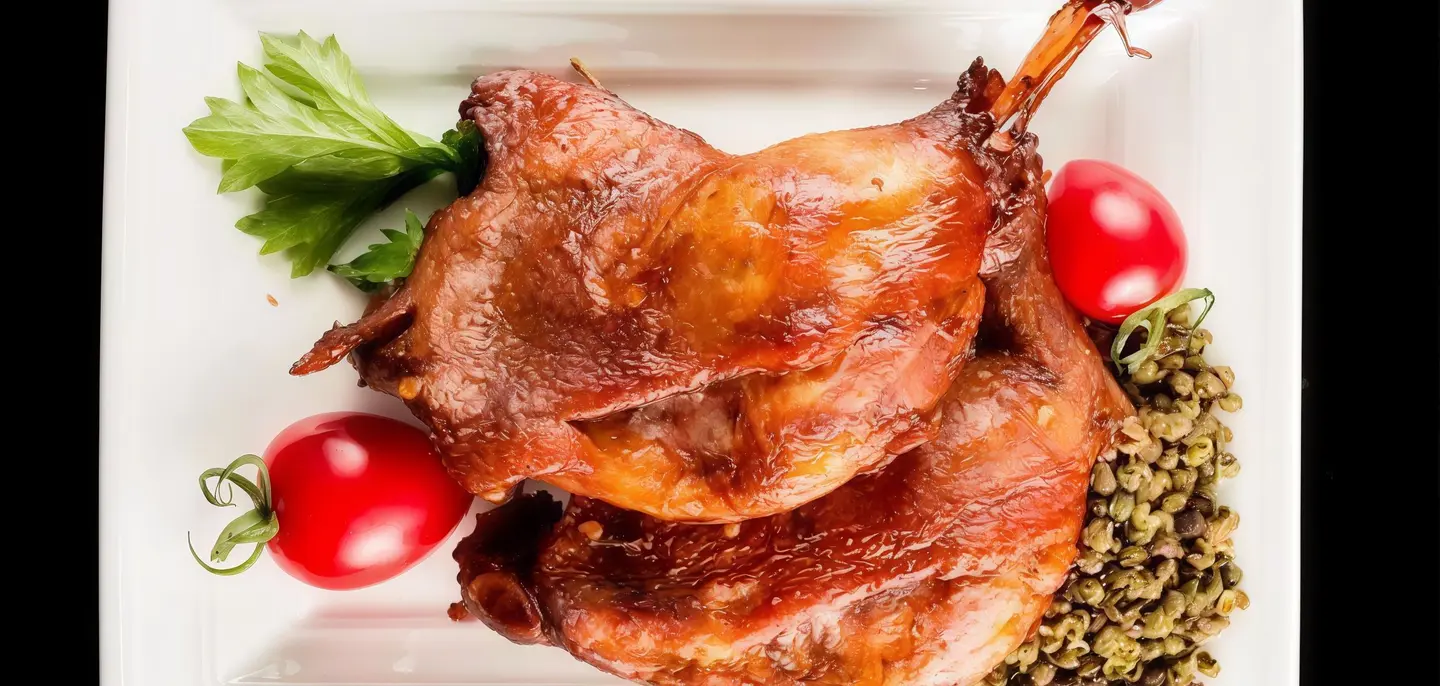 A Quarter Duck With Rice And Vegetables