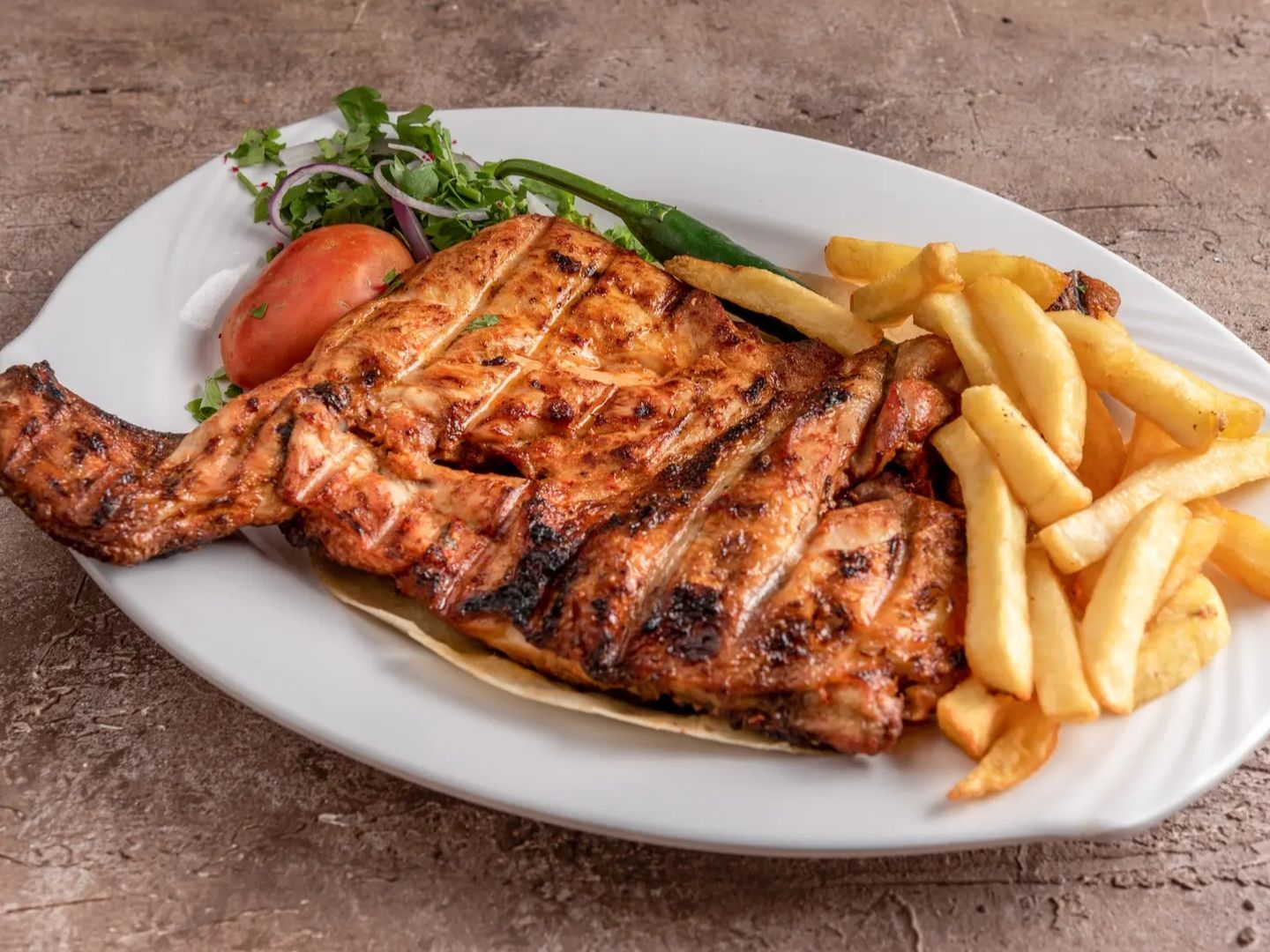 Half a chicken on charcoal with rice