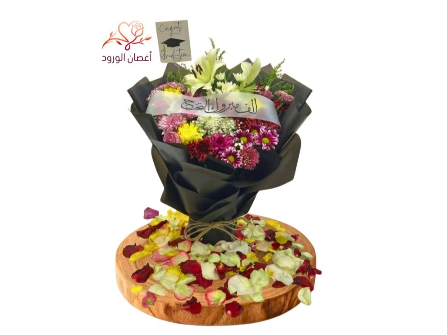 A Bouquet Of Natural Flowers In Various Colors With A Graduation Ribbon And A Suitable Card