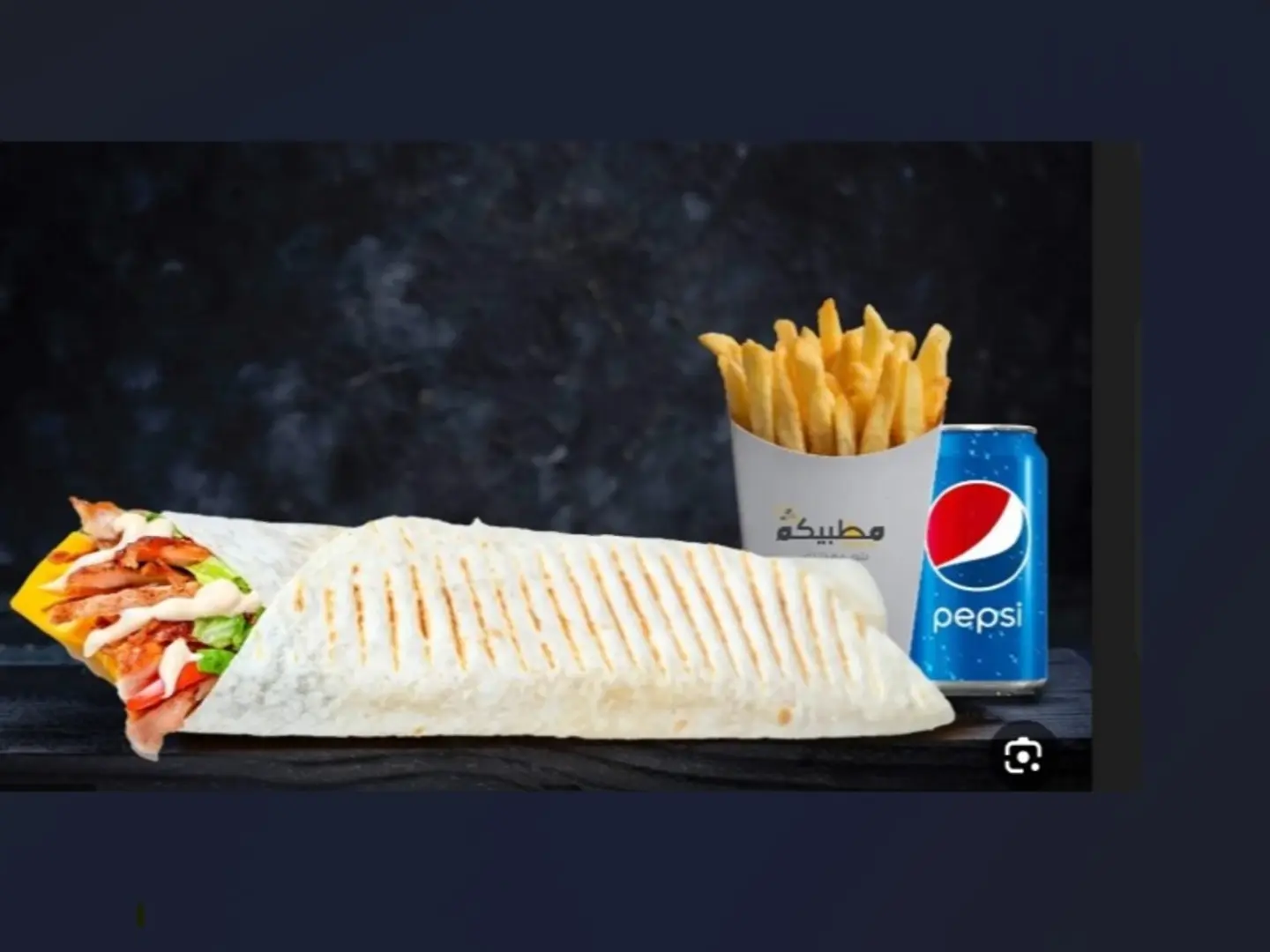 Grilled Chicken Breast Slices With Sautéed Onions, Lettuce, And Tomato Slices, Topped With Cheddar Cheese Slices, Jalapeño Pieces, And Your Special Mazzabi Sauce, Wrapped In A Tortilla Bread, Served With Pepsi And Fries.