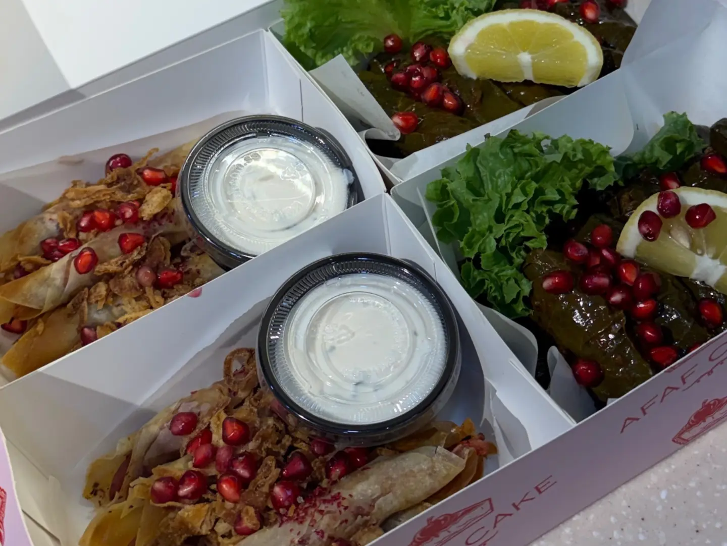 Box Of Stuffed Grape Leaves And Chicken Musakhan