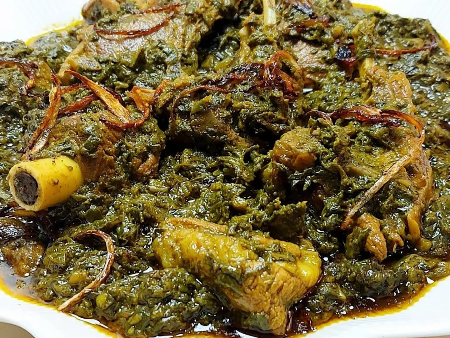 Mutton Palak Served With Two Rotis.