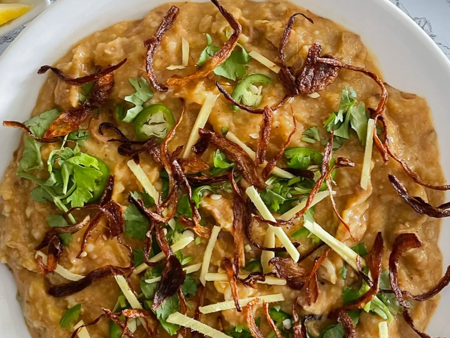 Chicken Haleem Served With Two Shami Kabab And Two Naan