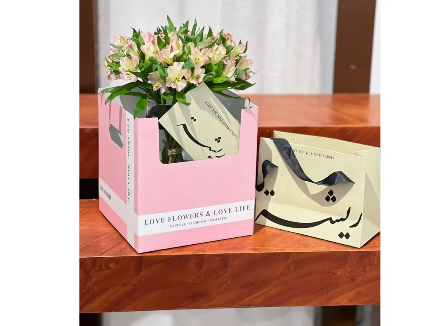 A Vase Of Roses With A Gift Card And Nail Polish