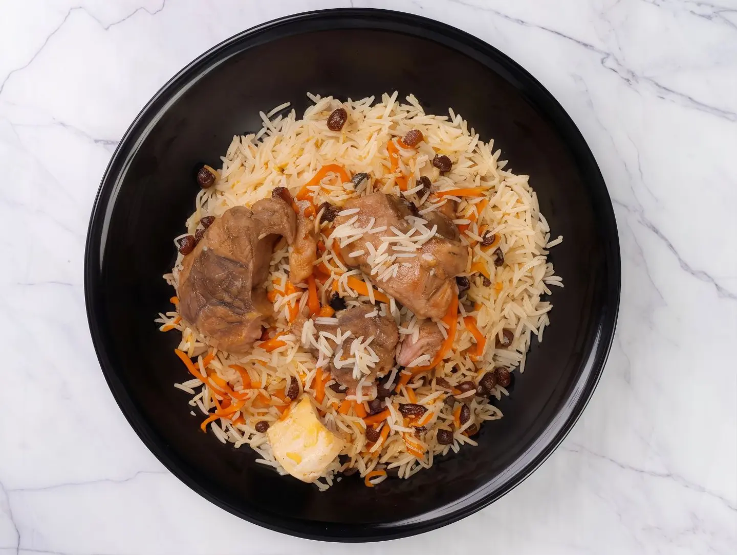 A Person With Meat Kabsa