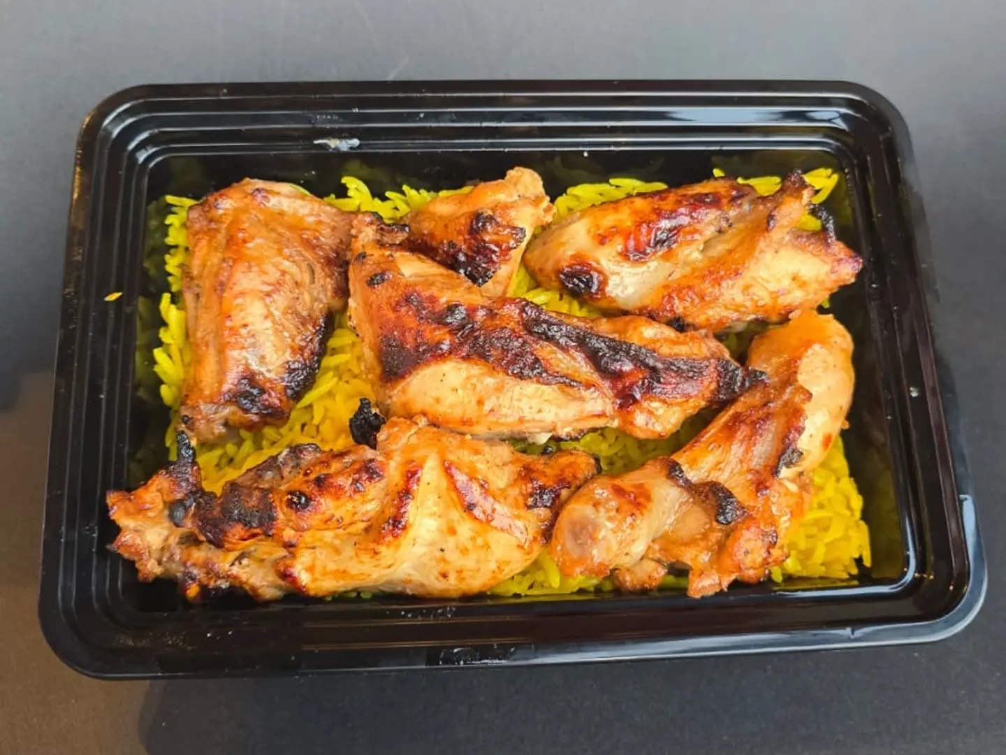 Half A Chicken Grilled On Charcoal