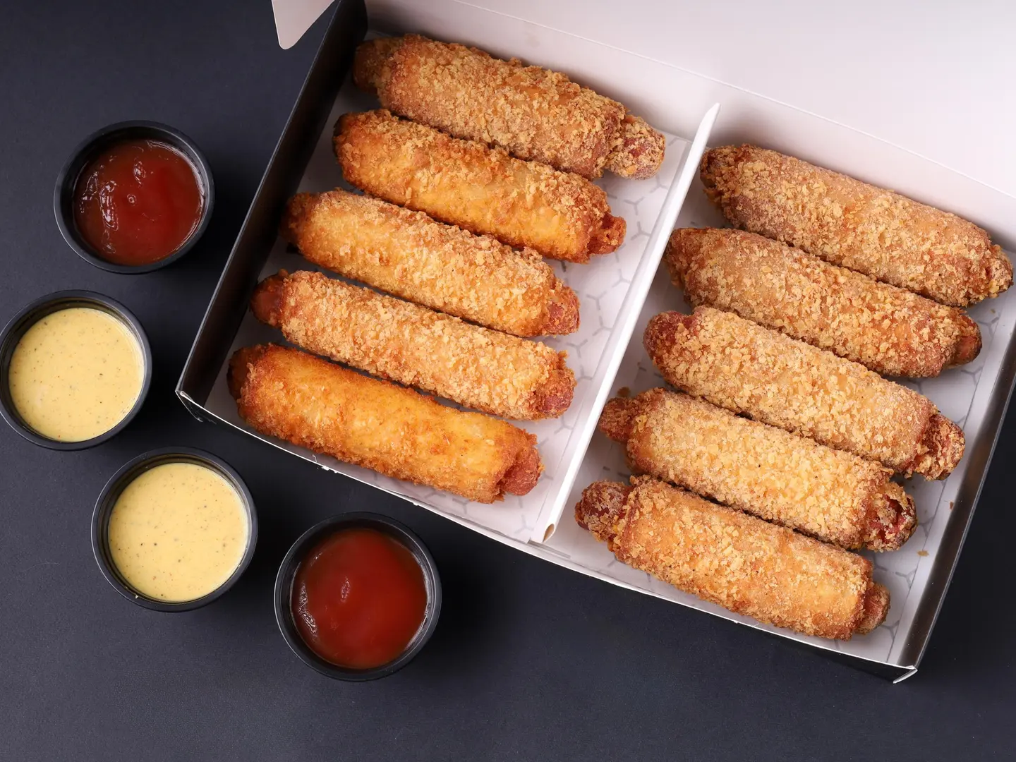 Pieces Of Sausages Wrapped In Toast Bread Covered With A Layer Of Crunchy Breadcrumbs Stuffed With Cheddar Cheese And Spices