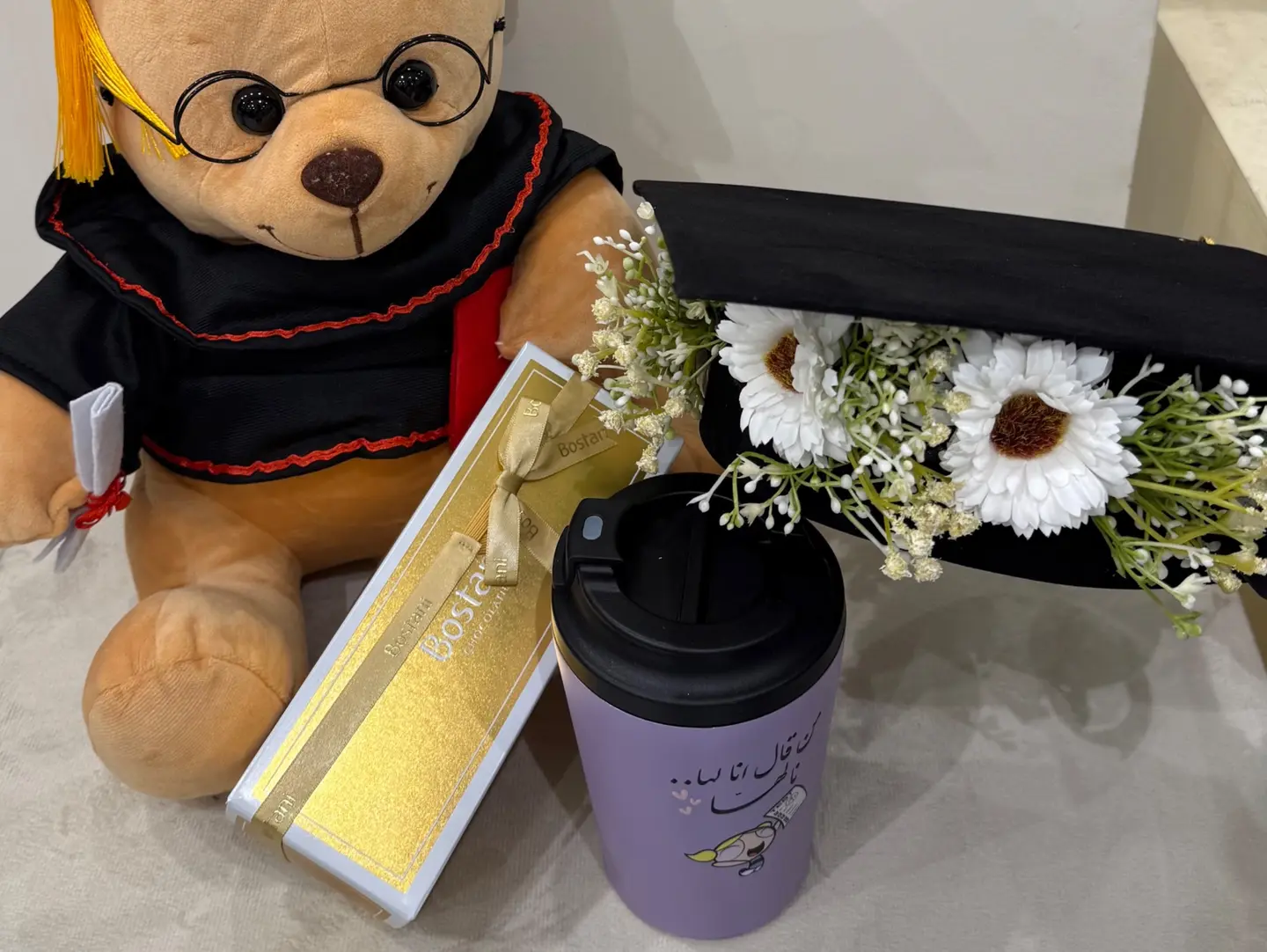 A Bouquet Of Roses With A Luxurious Bag Of Chocolates