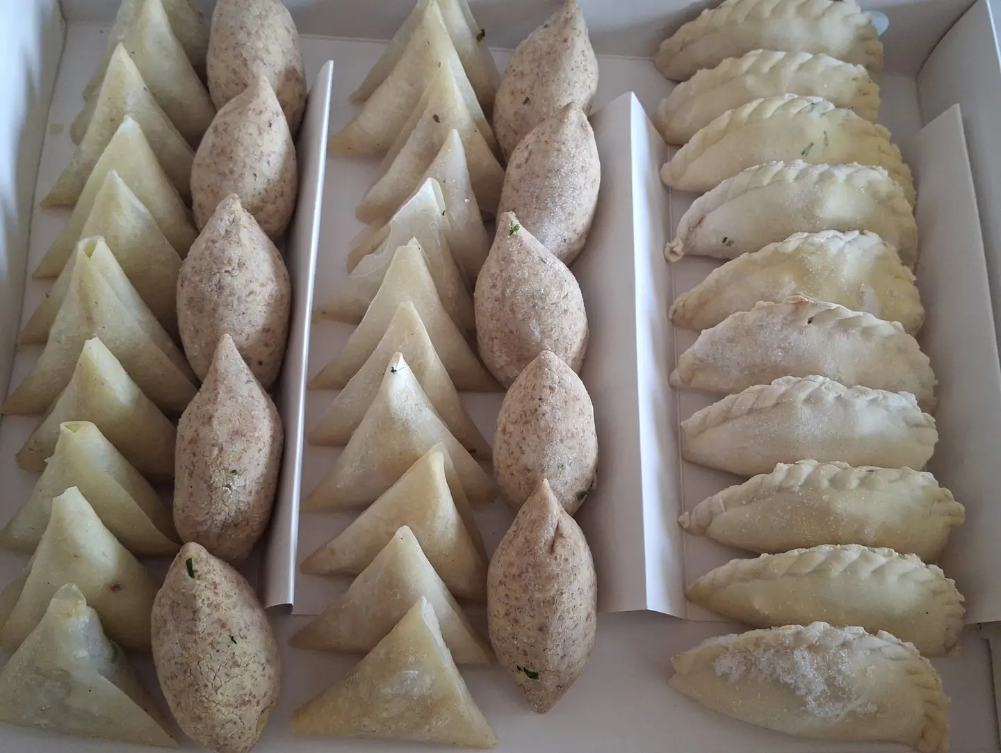 Mixed Box Of Sambosa, Kebbeh, Puff Pastry, And Cheese Fingers