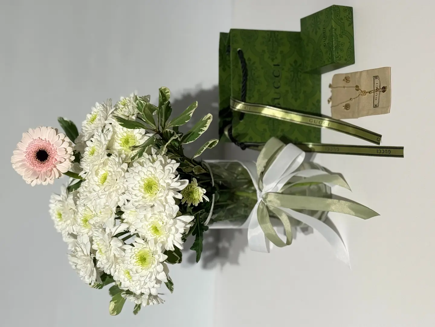 Gucci Necklace And Earrings And A Rose Vase
