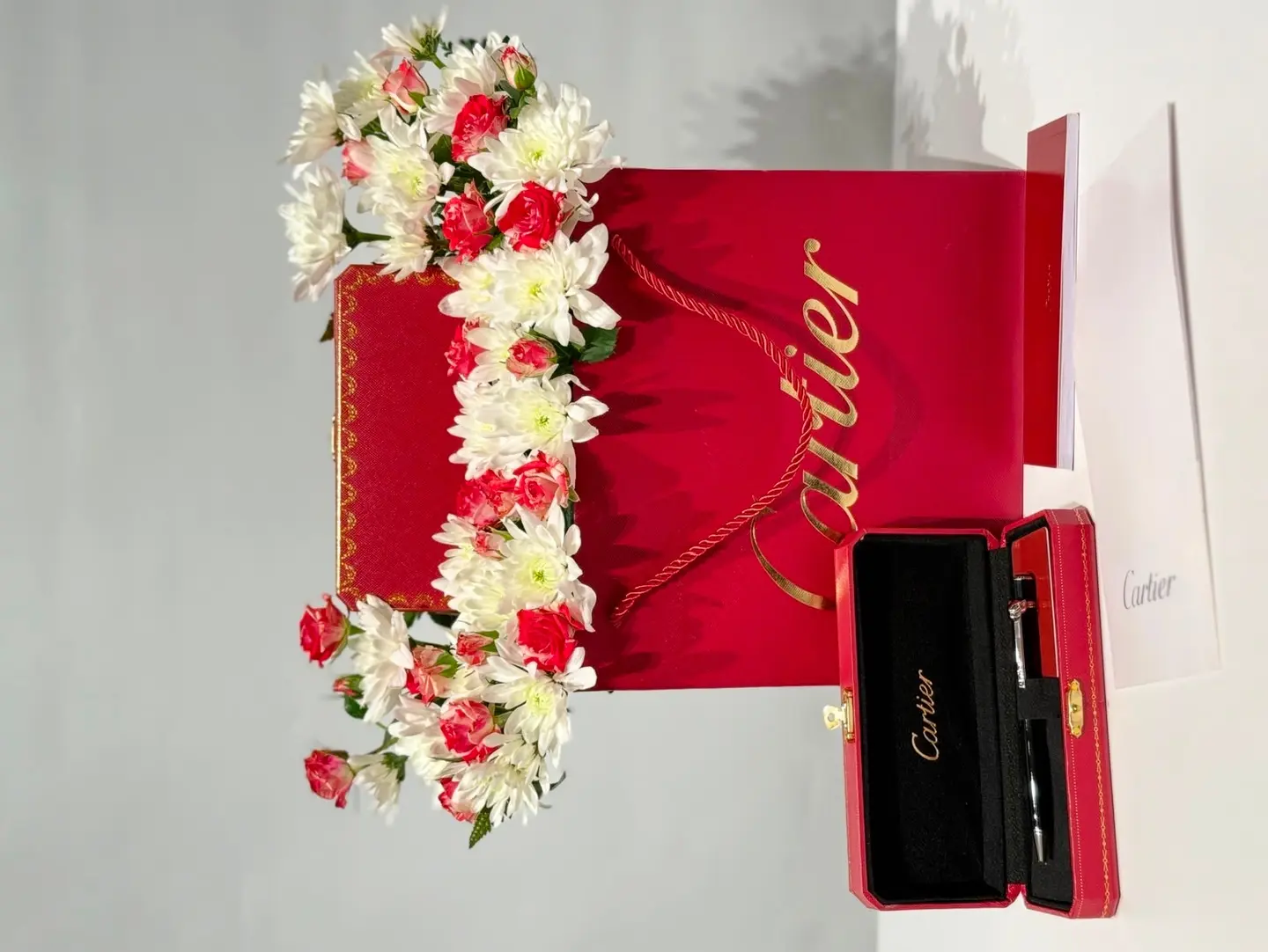 Cartier Pen With Fresh Flowers And A Complimentary Card.