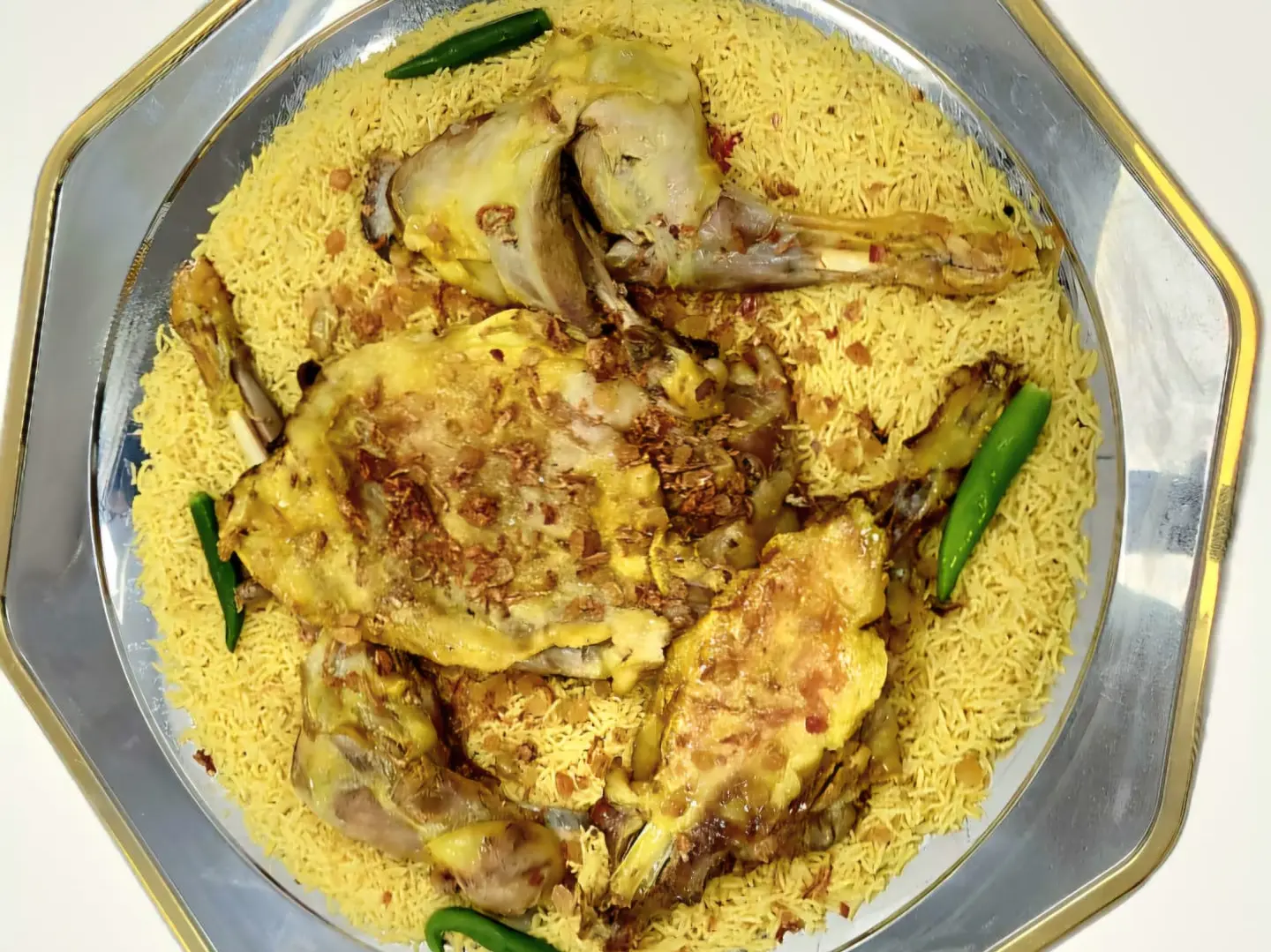 A Person Of Mandi Meat In The Oven
