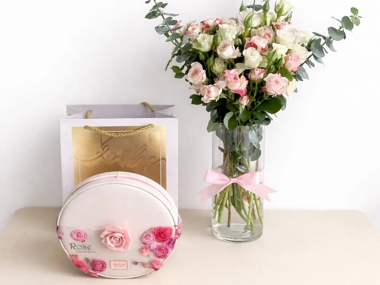 A Gardener's Vase And Arrangement