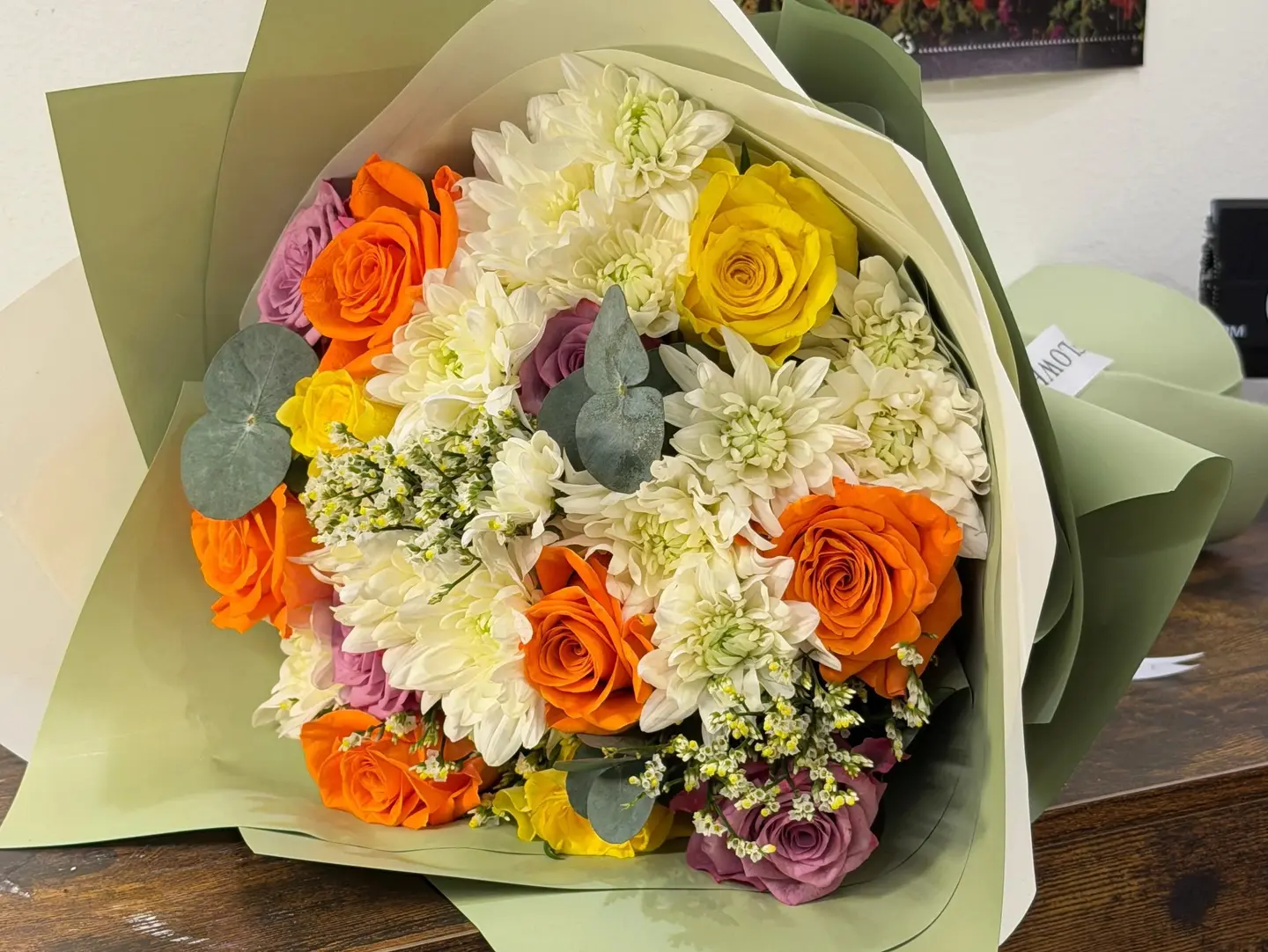 A Mixed Bouquet Of Mums And Roses.