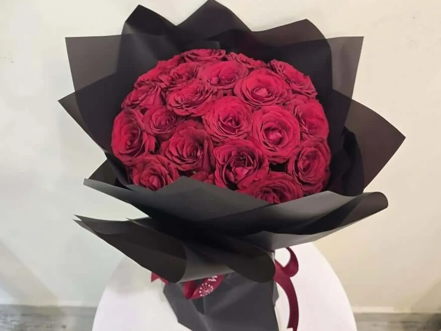 Red Roses Bouquet In Romantic Black Wrap