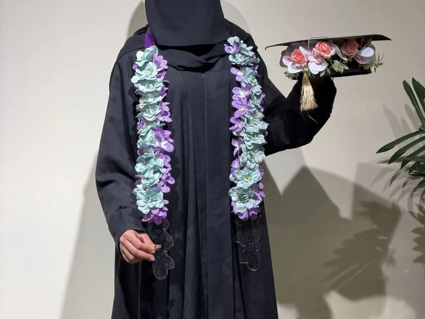 A Necklace Of Roses And A Graduation Cap