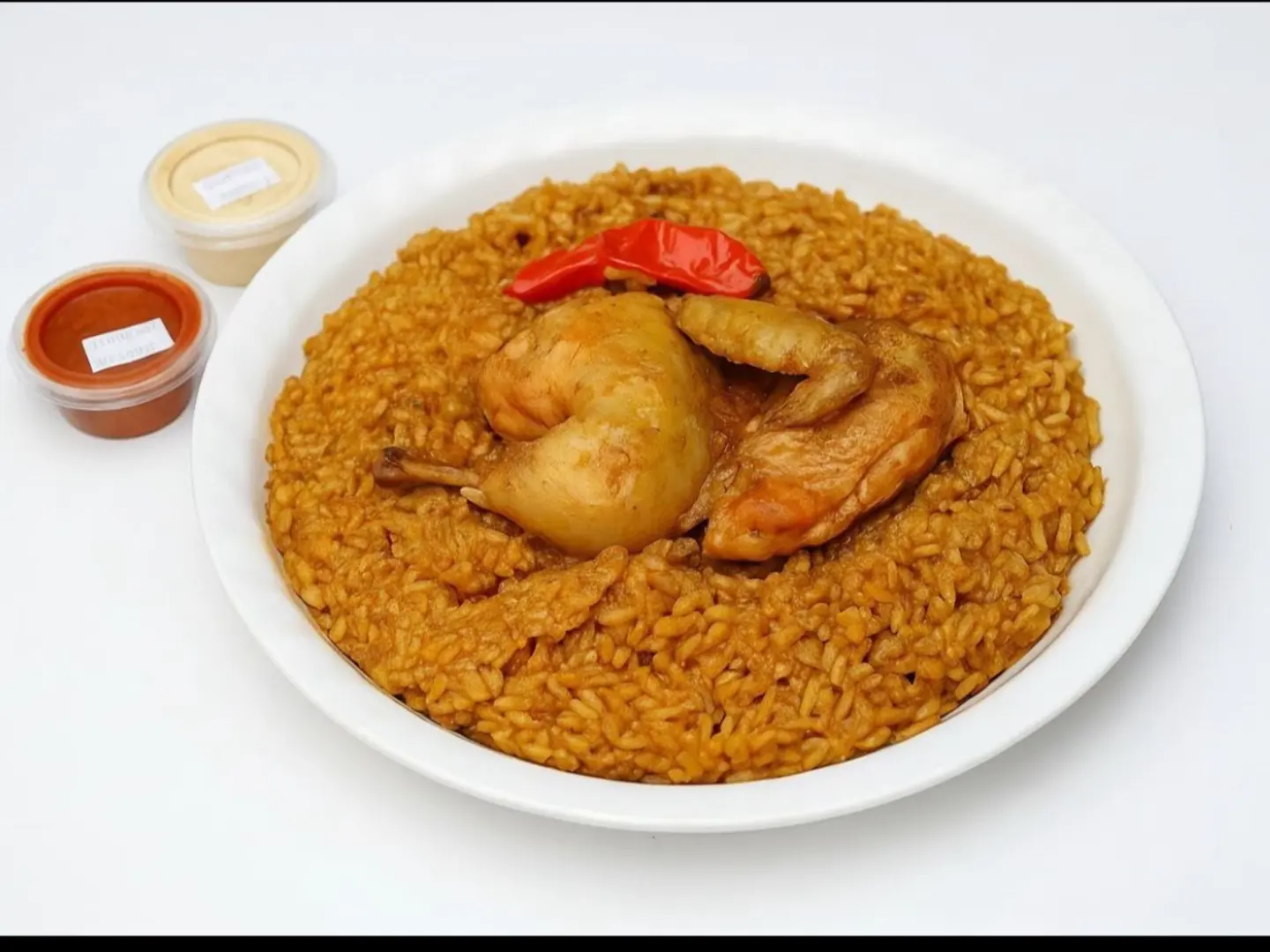 Half A Chicken With Red Rice, Abu Bint Style.