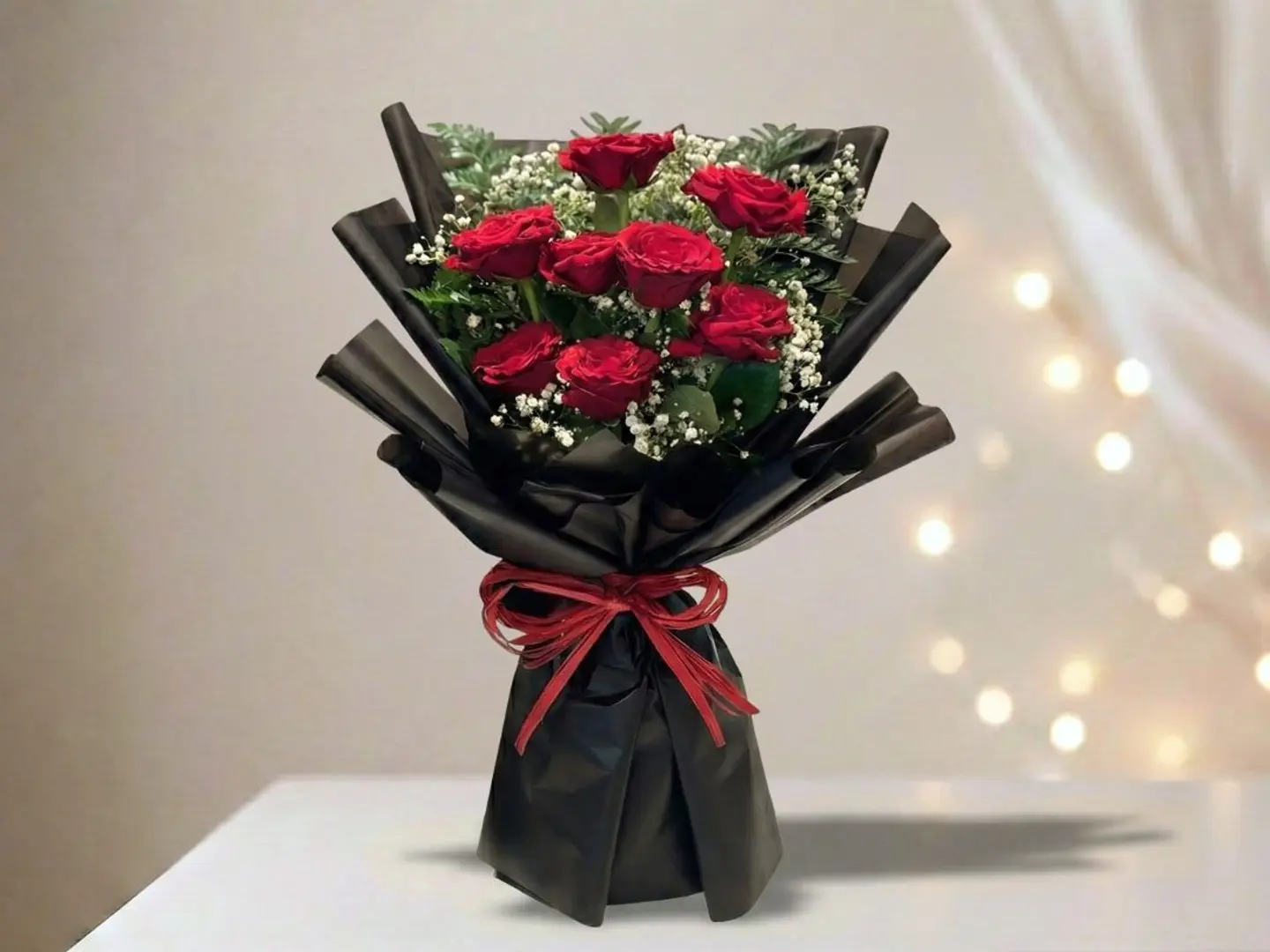 باقة الورد الأحمر بتغليف أسود