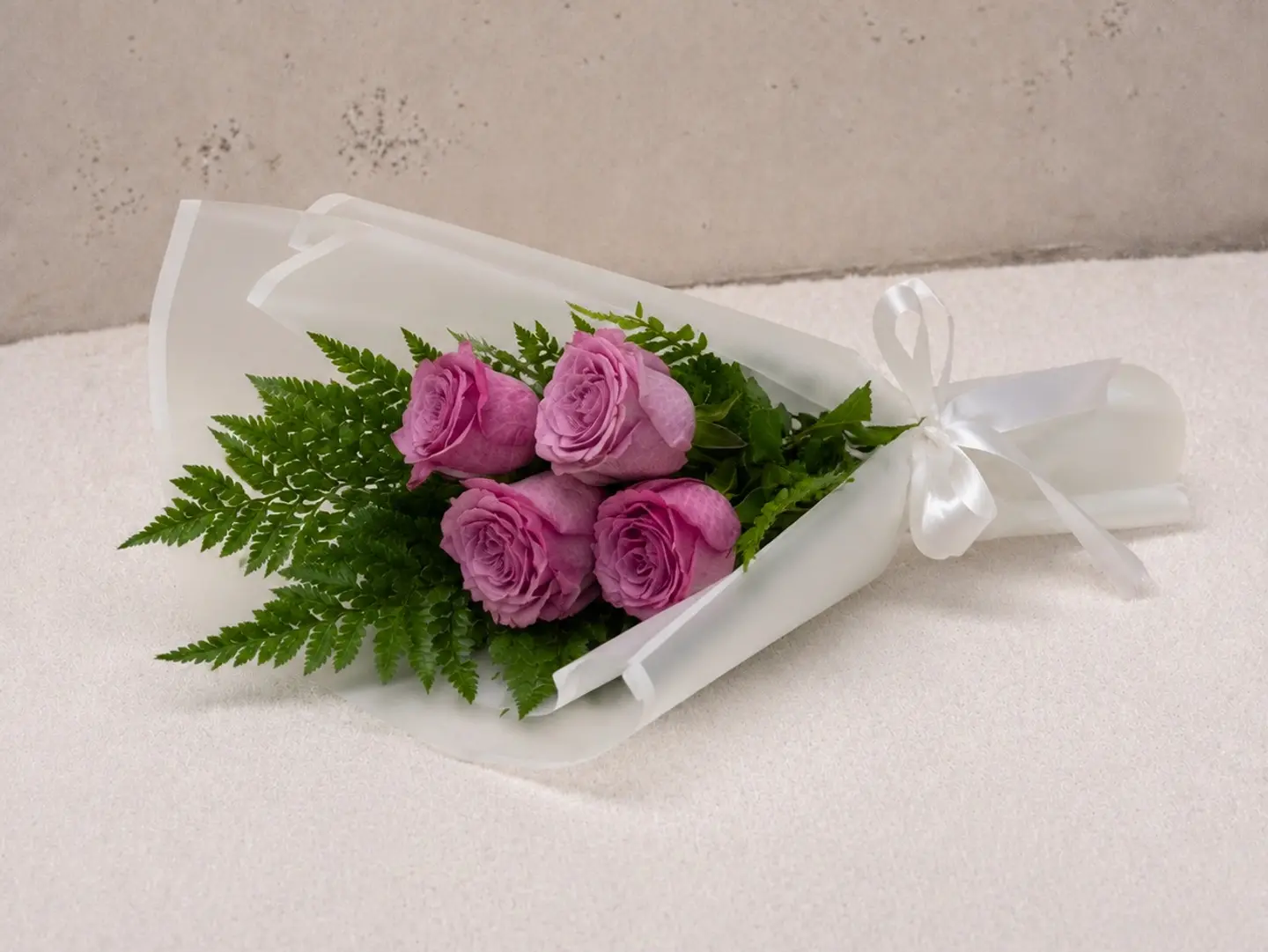 Purple Flowers Buoquet And White Wrapping