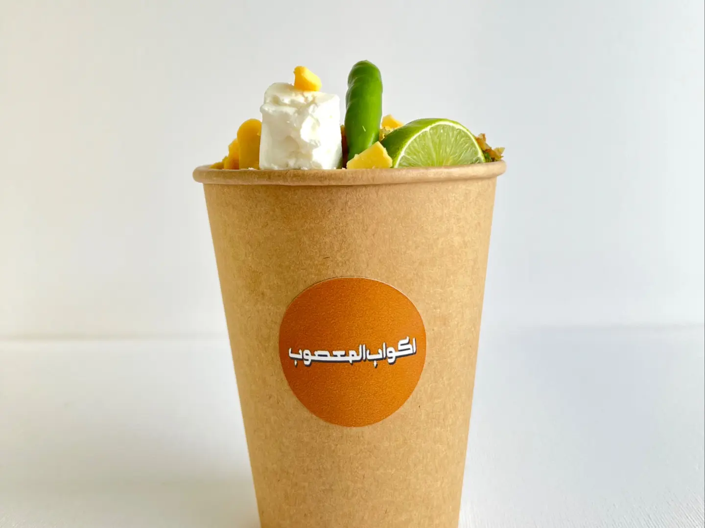 A Cup Of Vegetables And Two Cheeses