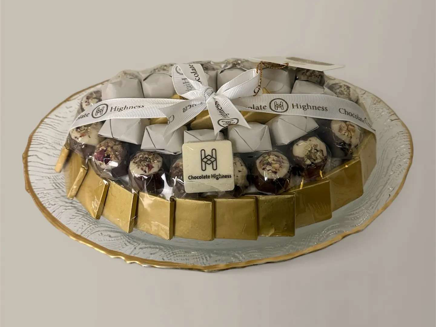Assorted Chocolates In A Glass Pot With Gold Edges