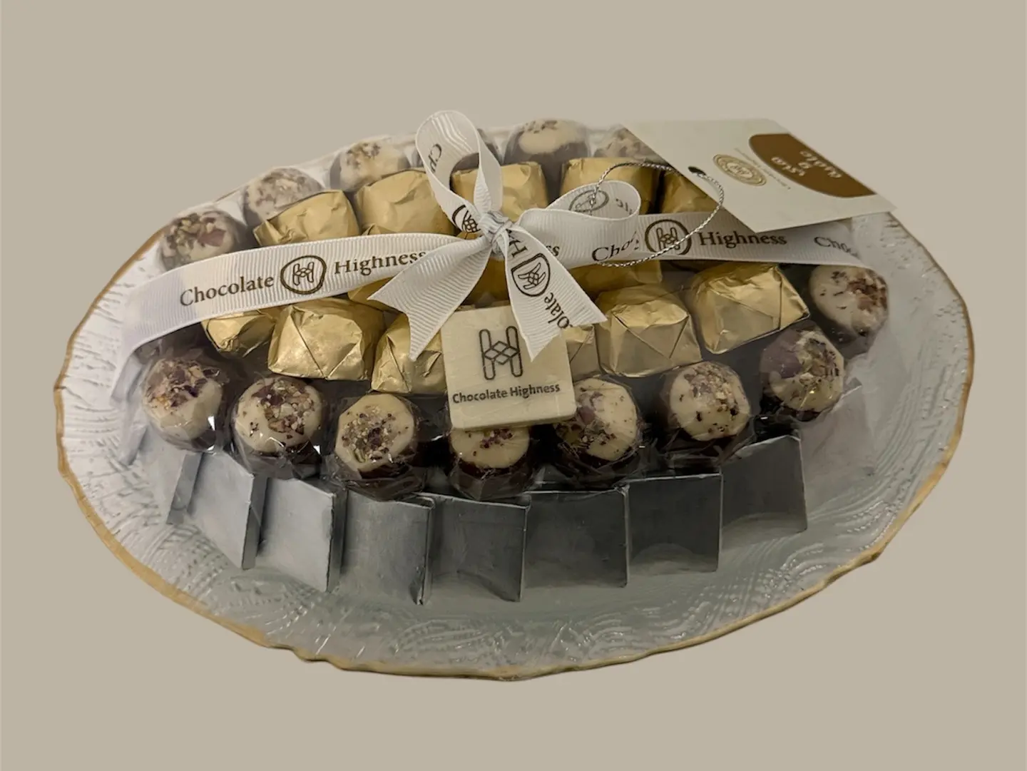 Assorted Chocolates In A Glass Pot With Gold Edges