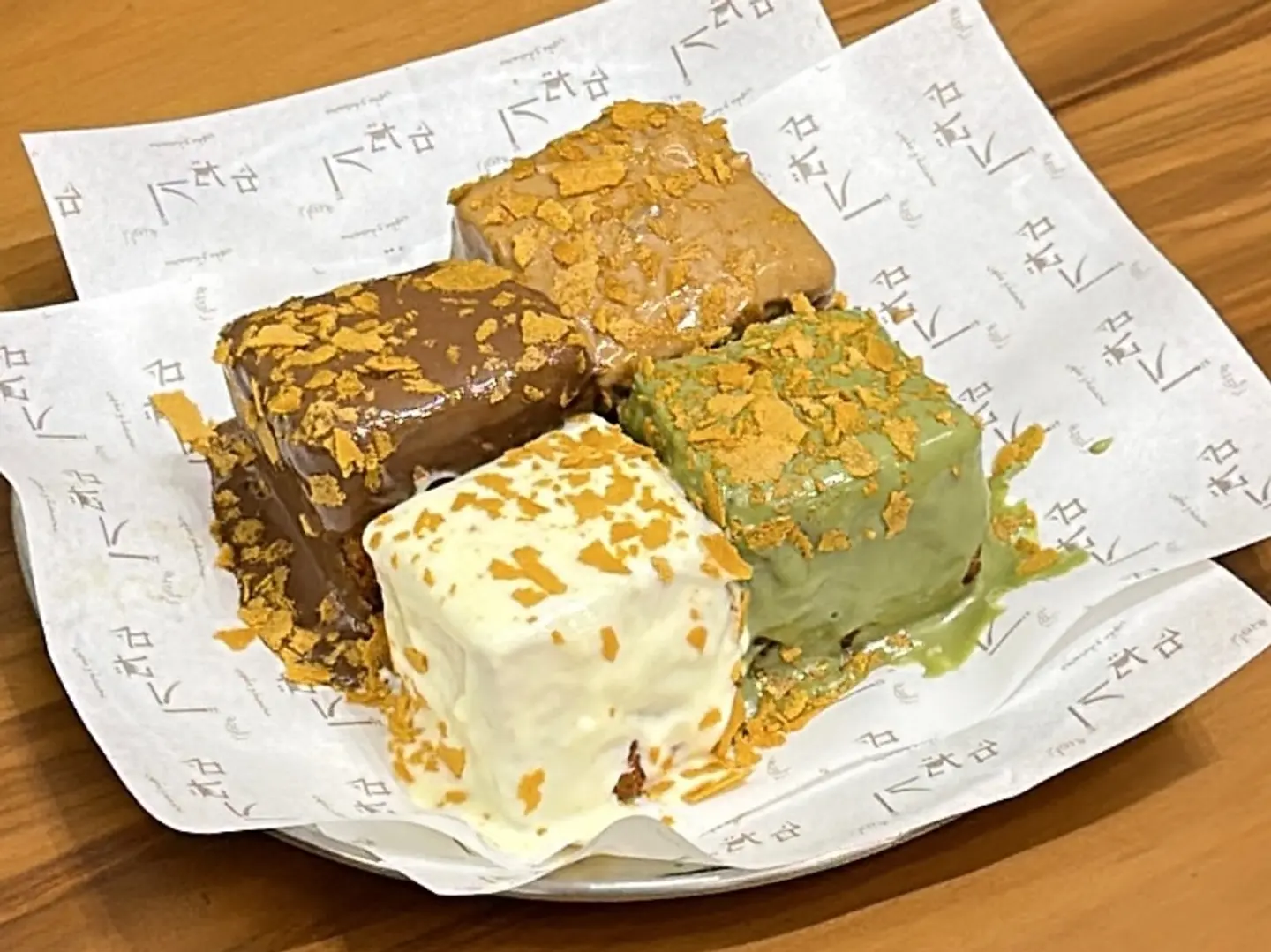 Four Pieces Of French Toast With Assorted Sauces