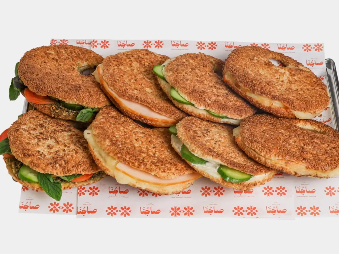 8 Assorted Slider Kaak Filled With Thyme And Vegetables, Cheese And Smoked Turkey, Mixed Cheese, Labneh And Cucumber