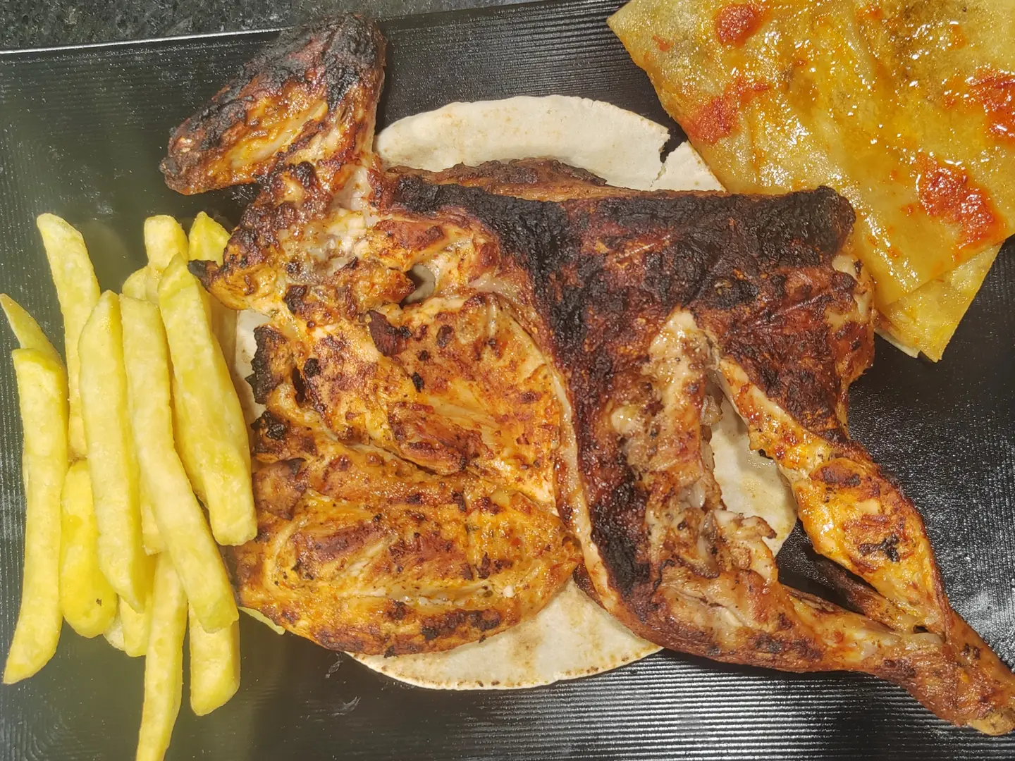 نصف دجاجة مشوية