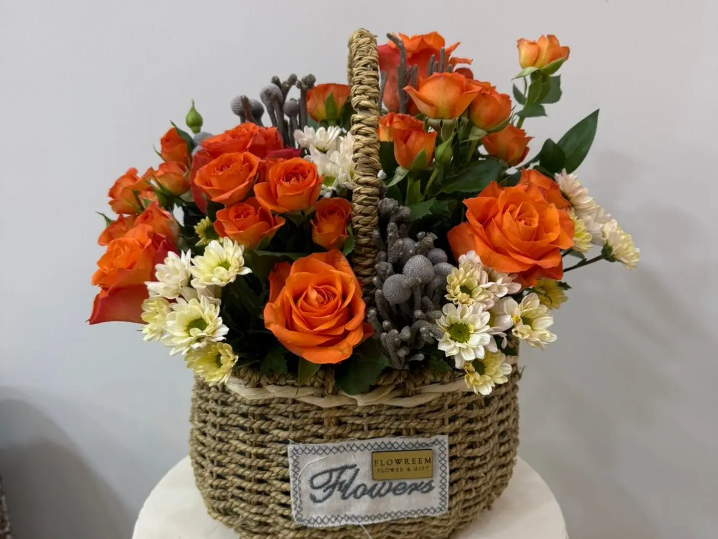 The Basket Of Oranges Roses Mix With Flowers