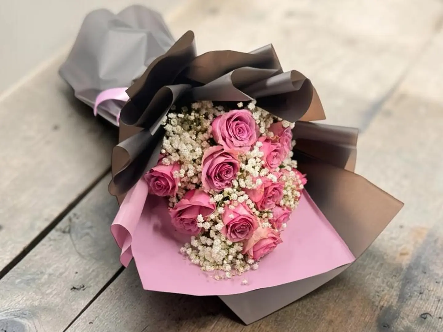 A Purple Roses With Baby Breath