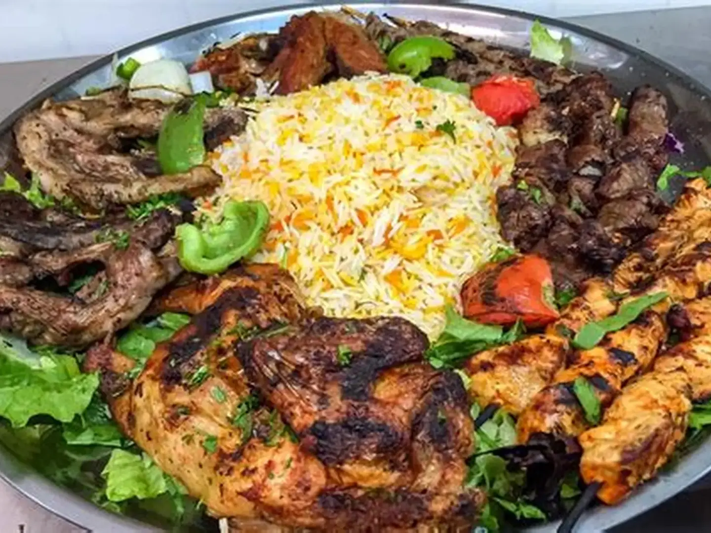 Platter Of Skewers: Kebab, Kofta, Grilled Chicken, Hawawshi, And Shish Tawook With Rice, Salads, And Stuffed Intestines