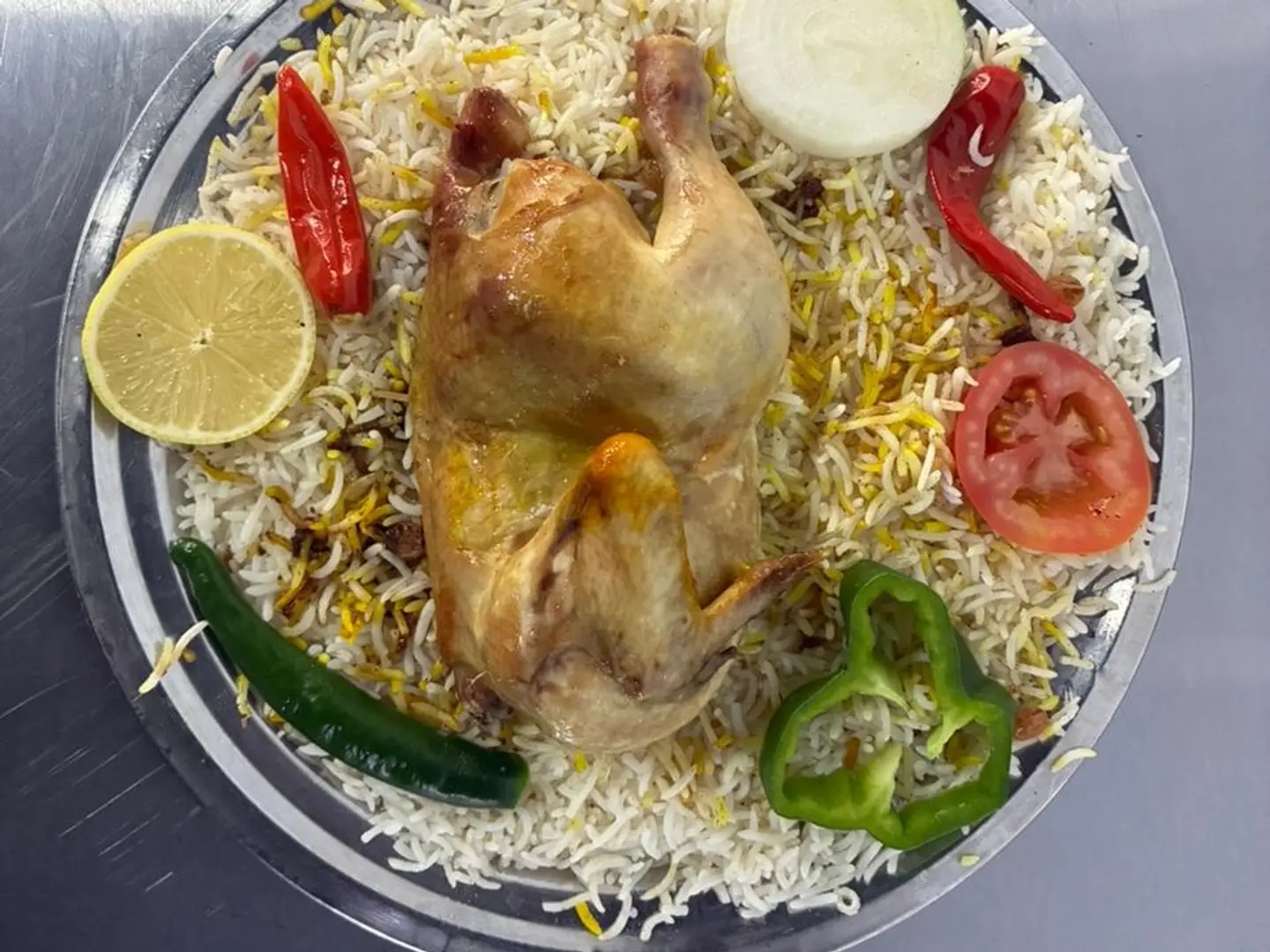 Madfoon Chicken With Shabi Rice