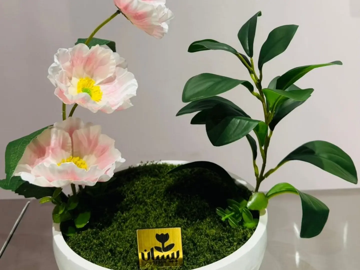 Pink Artificial Flower Arrangement With A White Vase