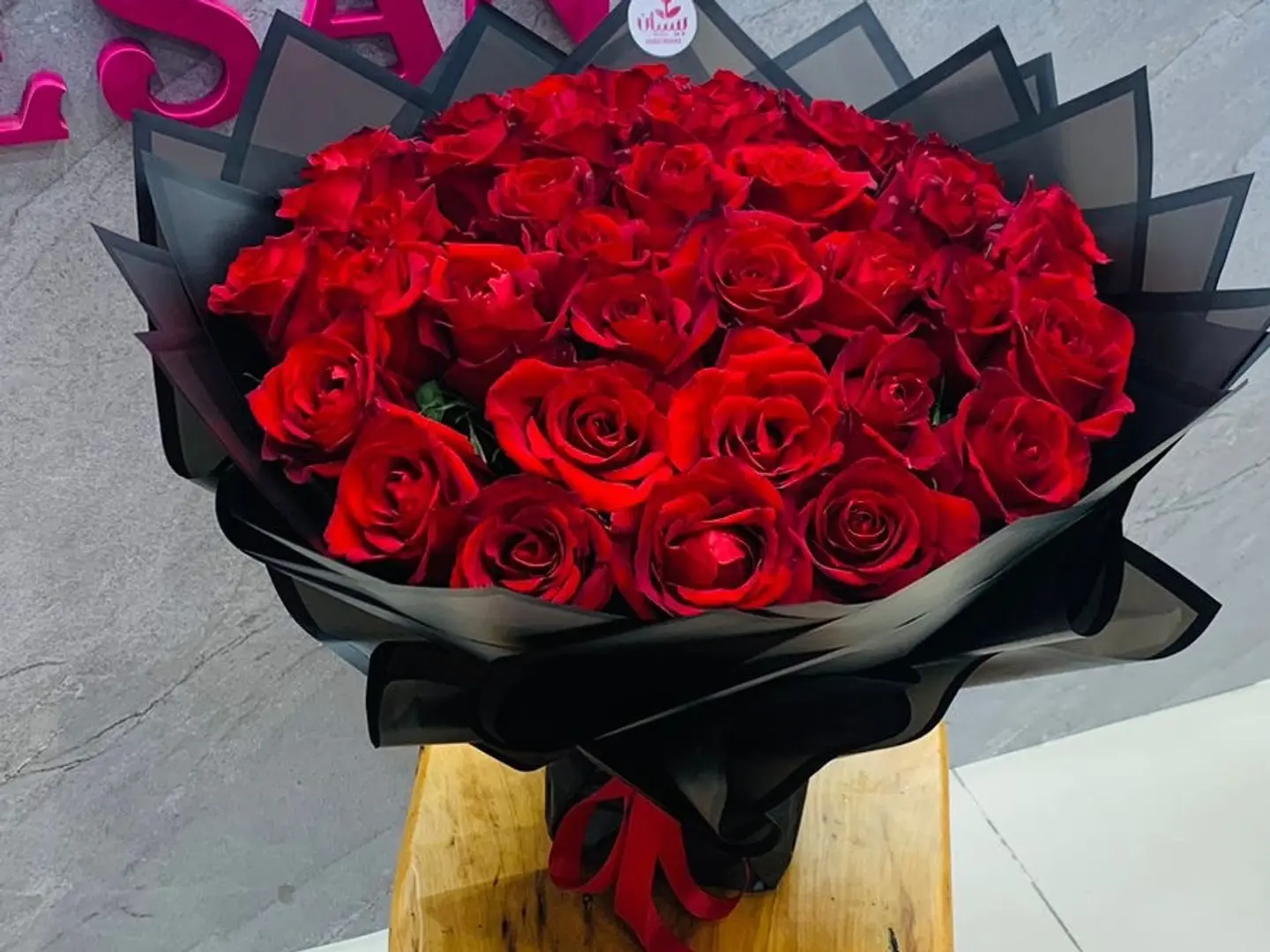 Large Bouquet Of Beautiful Red Roses With Black Wrapping