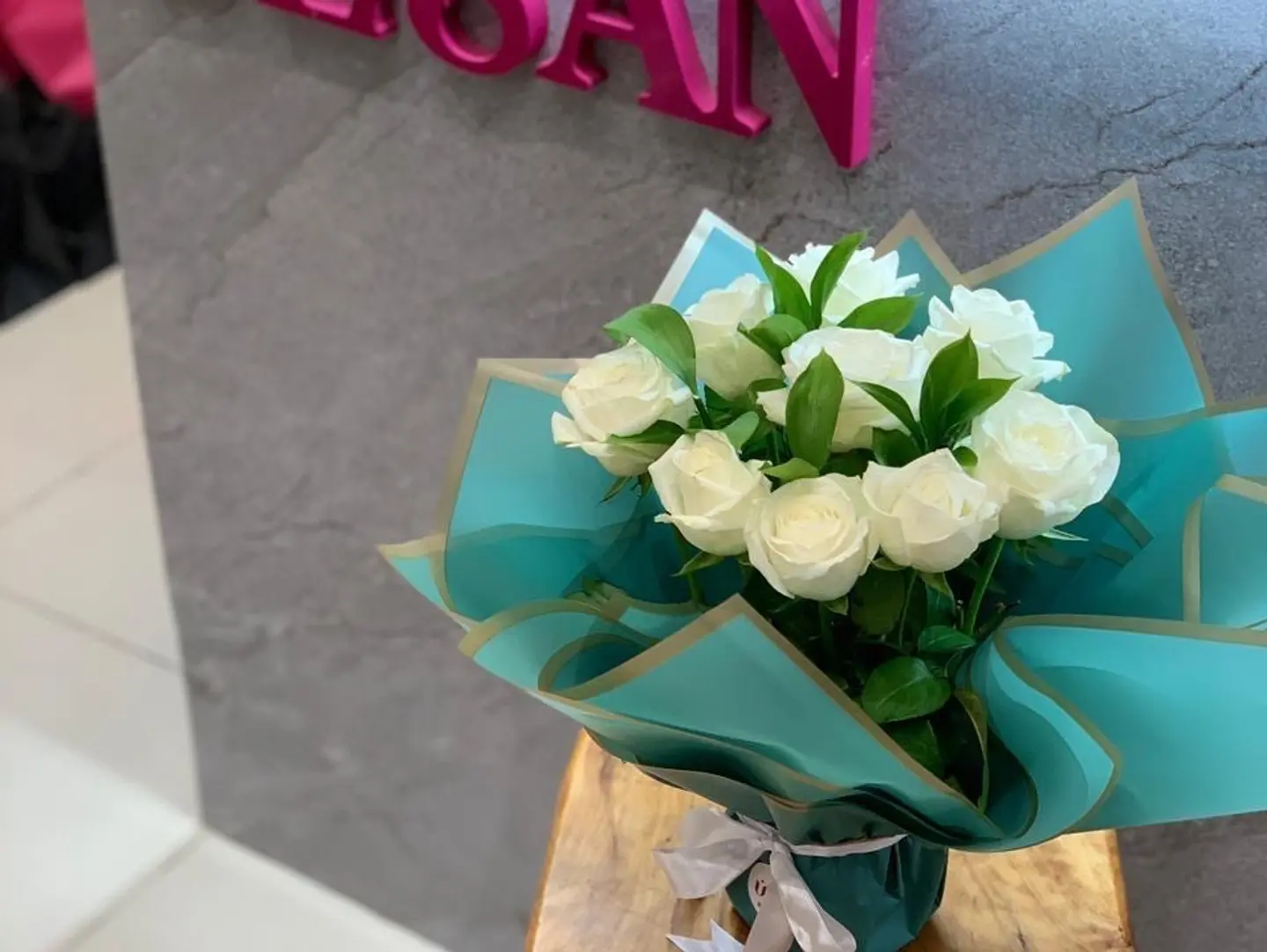 White Roses Wrapped In Beautiful Shades Of Green
