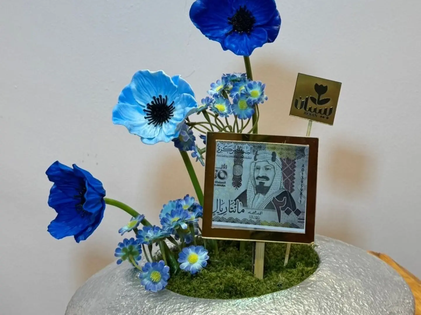 Industrial Arrangement In Shades Of Blue With A Silver Vase