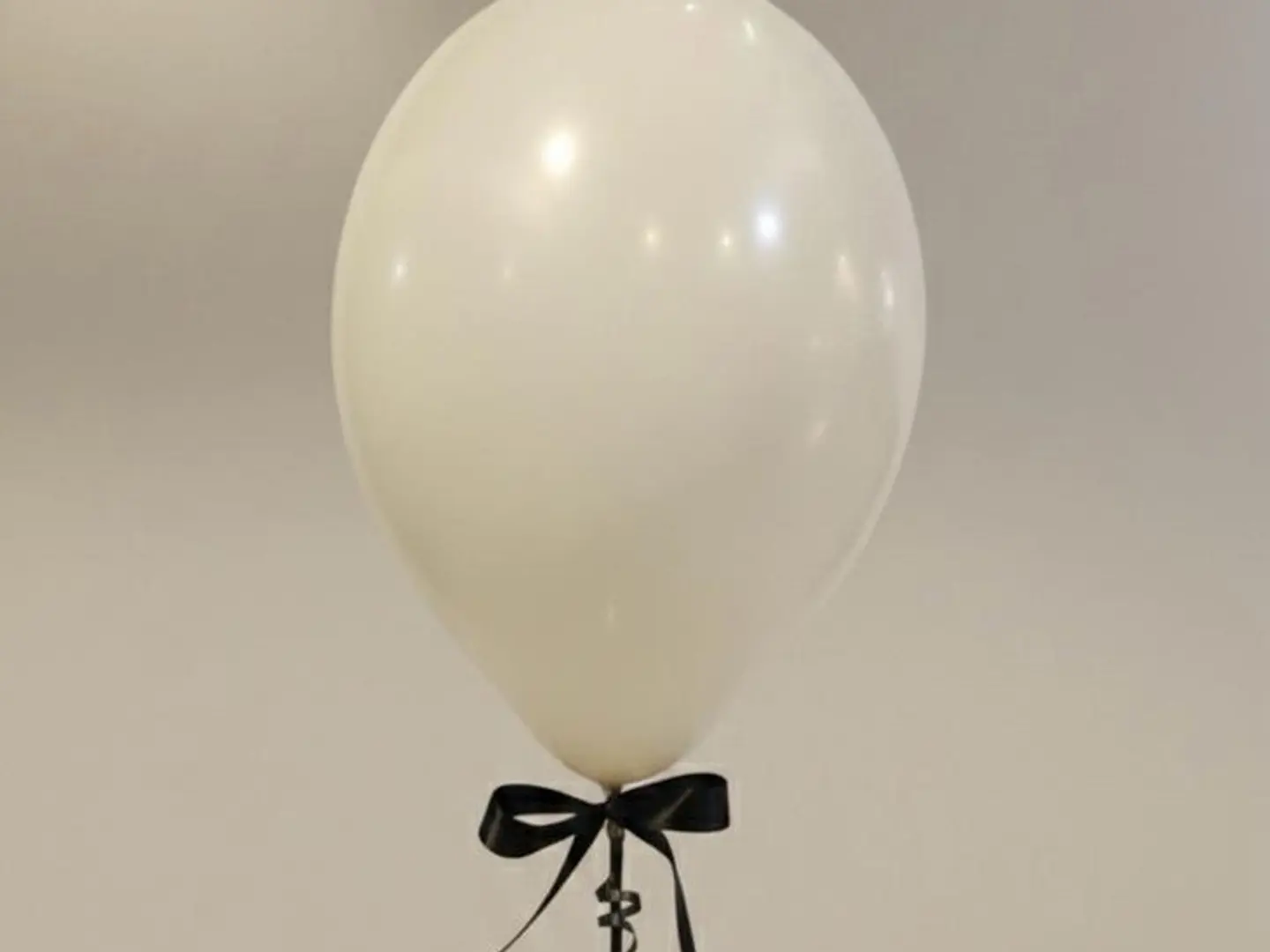 Off White Balloon With Black Ribbon