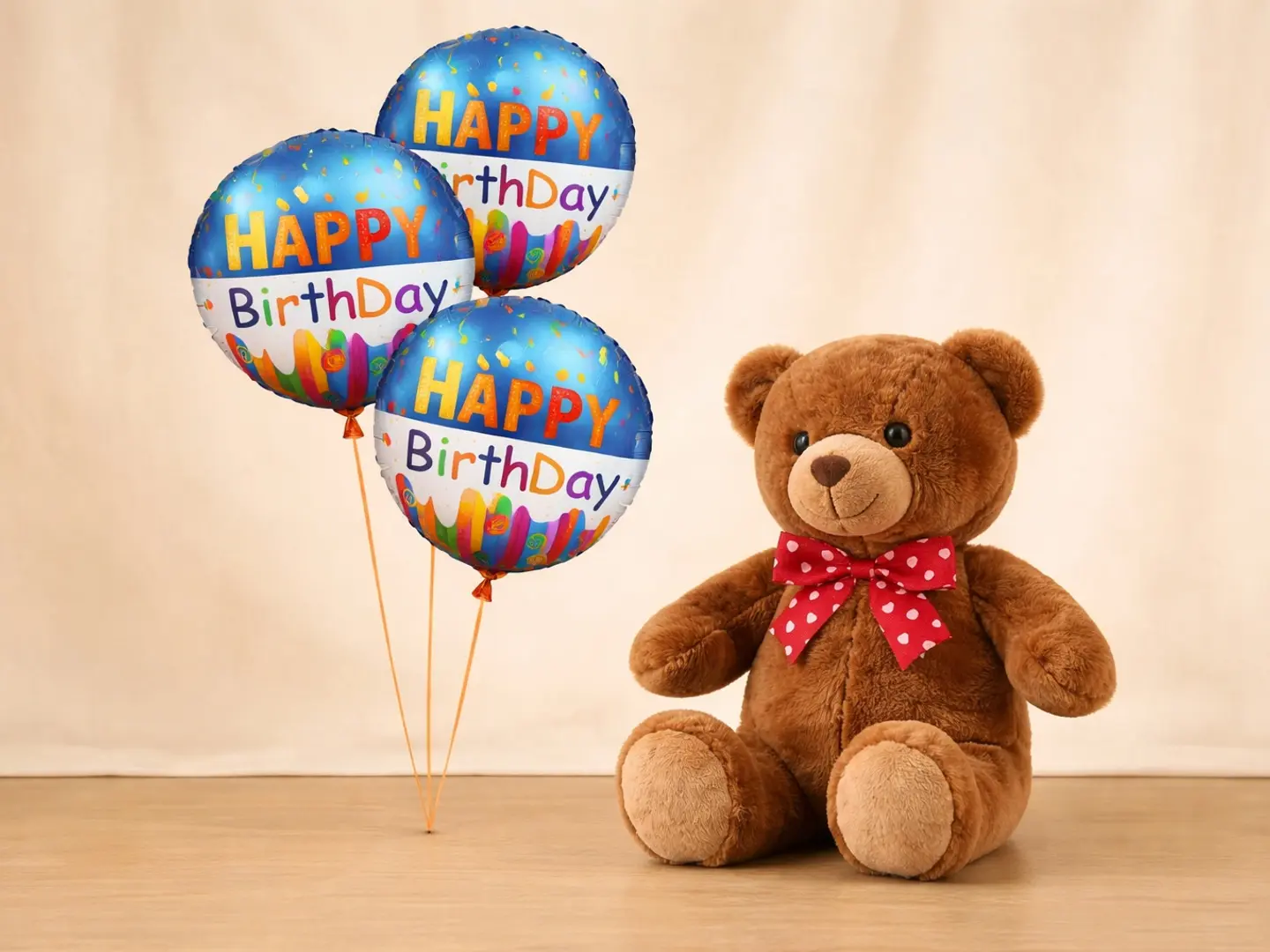 دمية دب بنية اللون مع بالون هيليوم مكتوب عليه عيد ميلاد سعيد