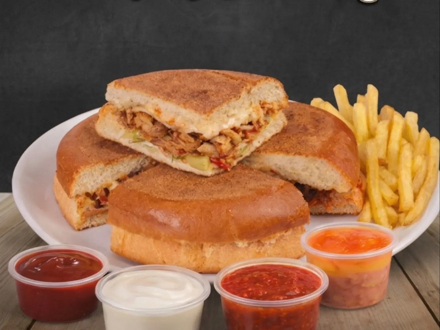 Spicy Shawarma With Cheese In Bashka Bread With Potatoes And Sauces