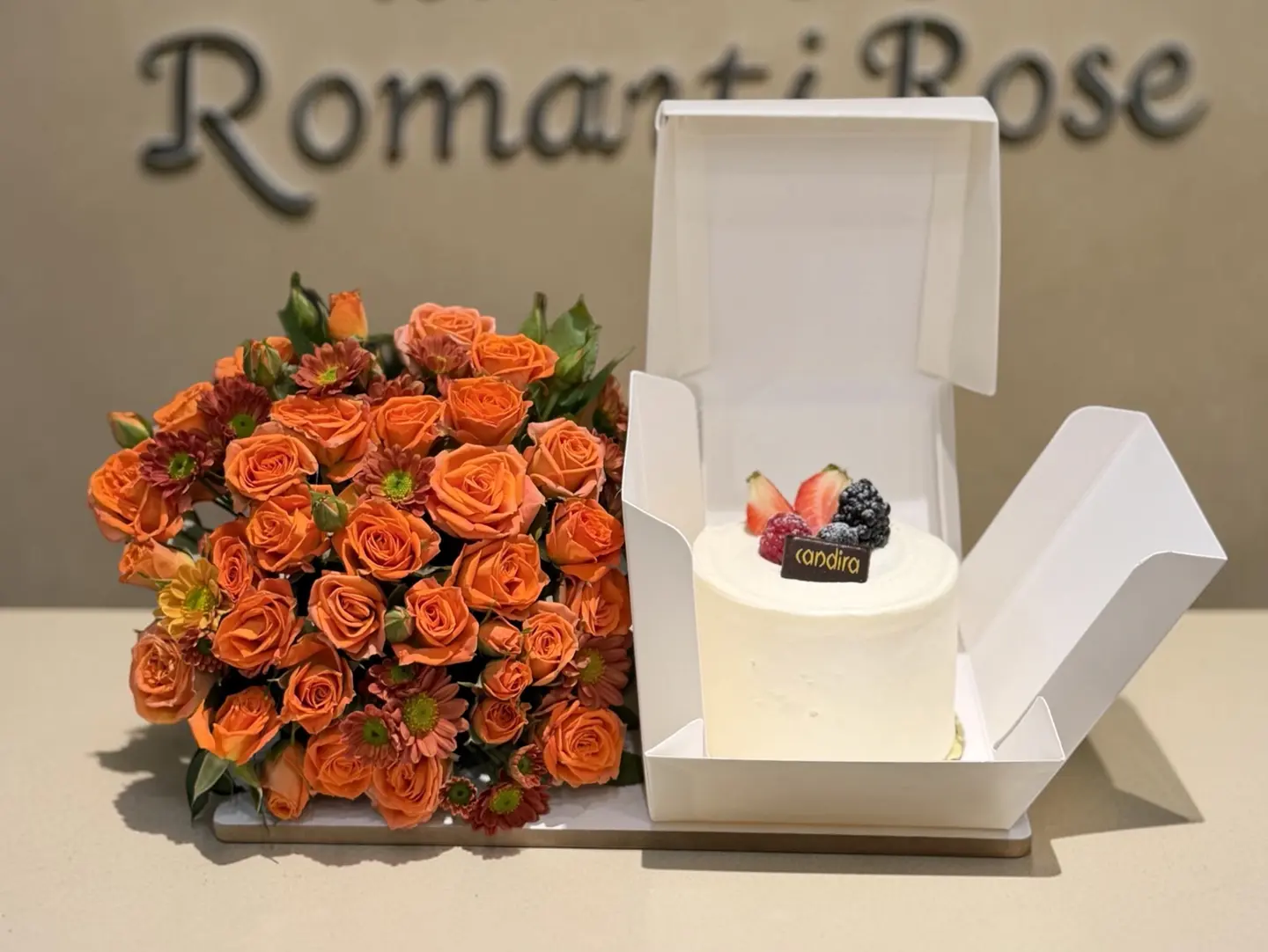 Candira Cake With Orange Roses