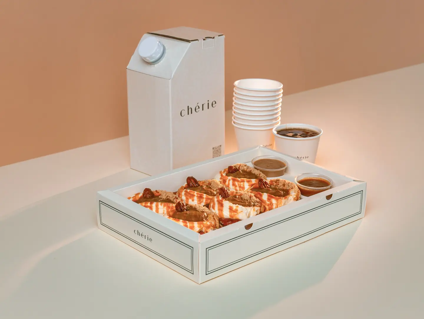 A Cinnamon Roll Box With 1 Liter Of Coffee