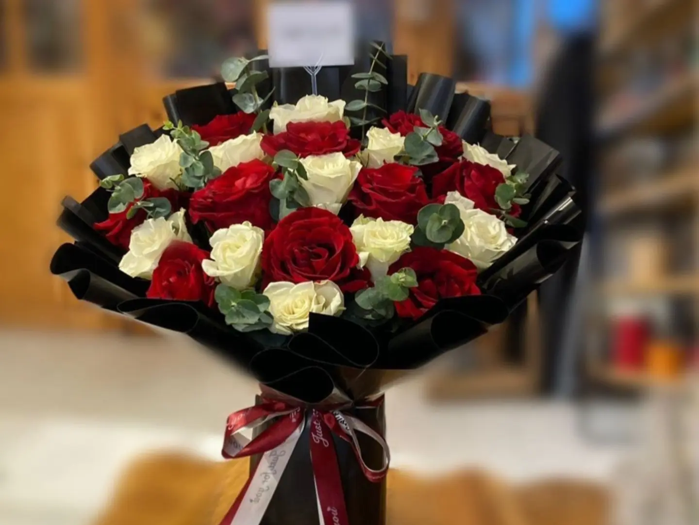 Red And White Rose Bouquet With Black Wrapping
